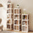 4-Tier Foldable Rotating Bookshelf with Swivel Base and Translucent Panels-White